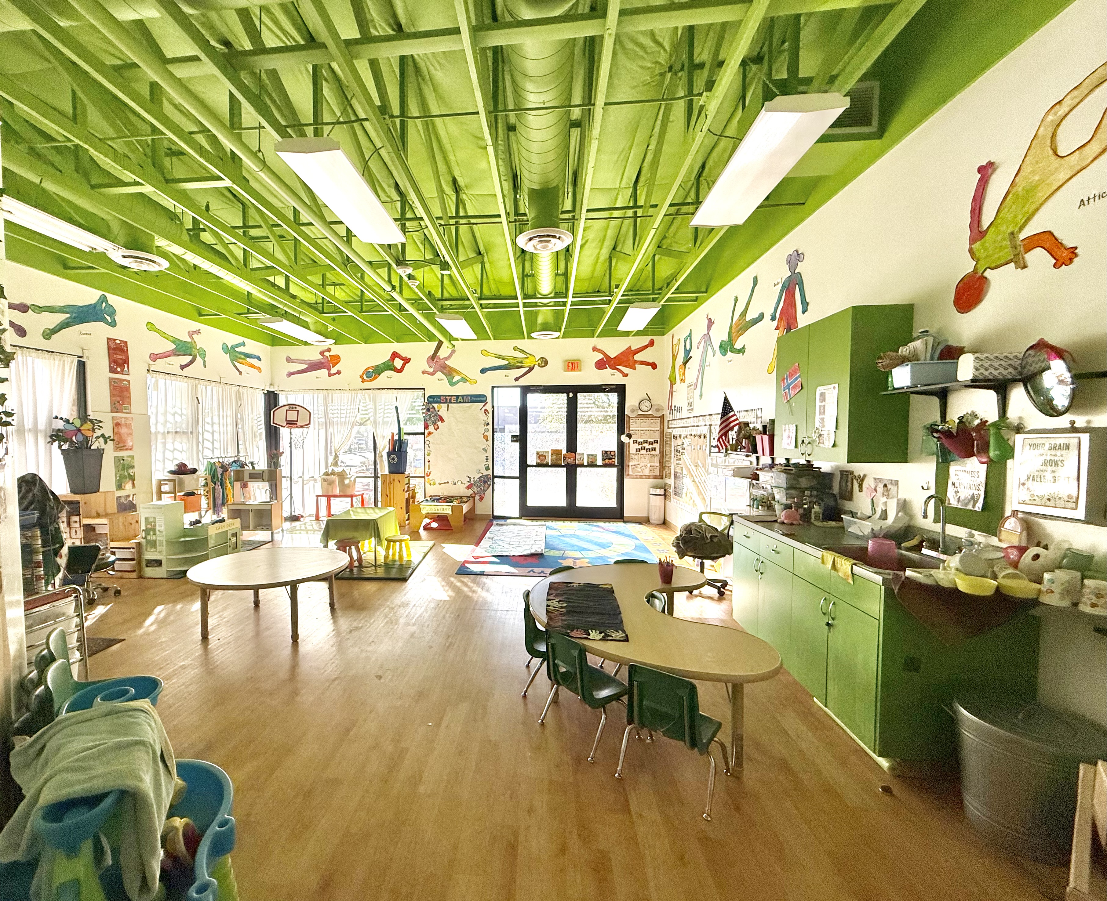 Light-filled classroom with centers and reading area